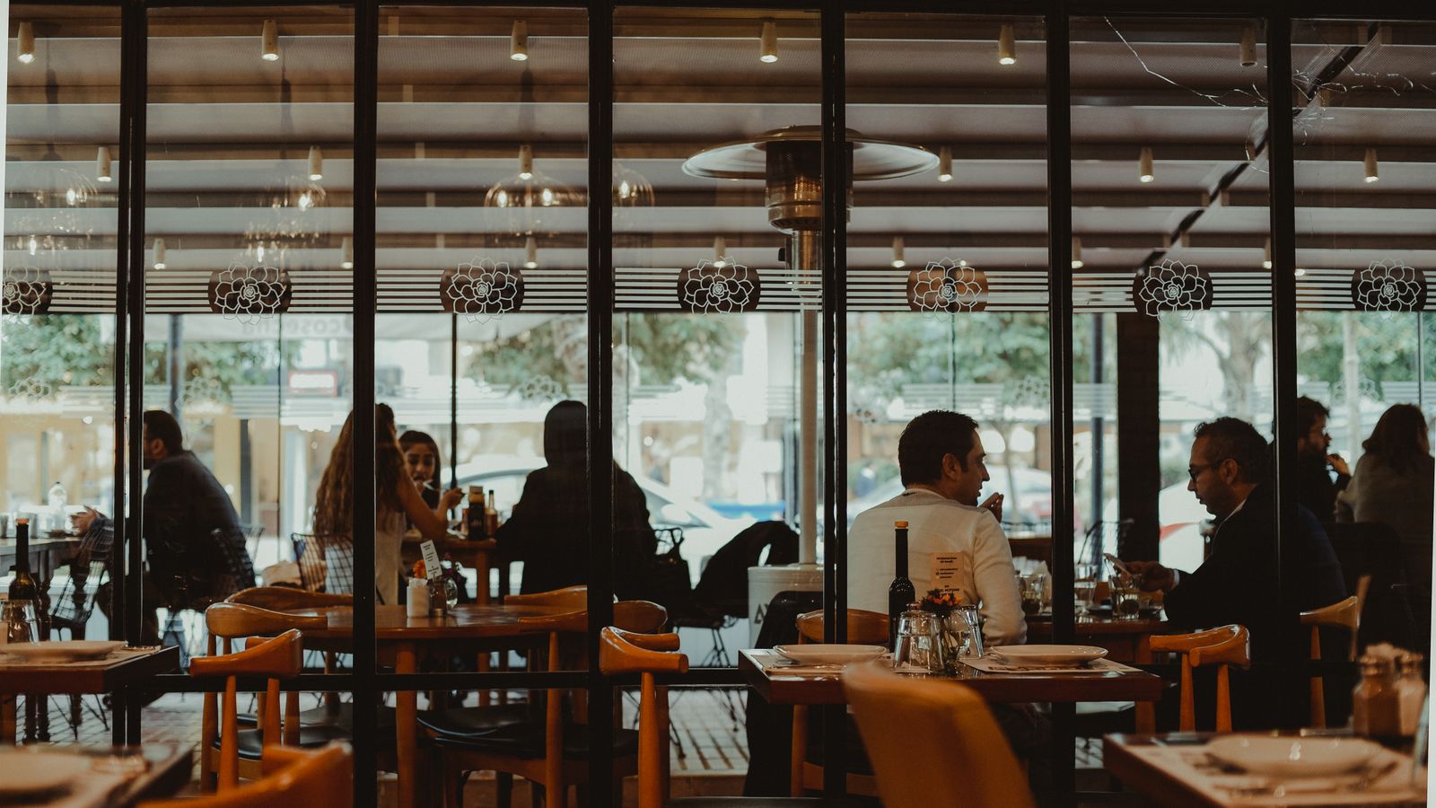 Diners at tables inside a restaurant
