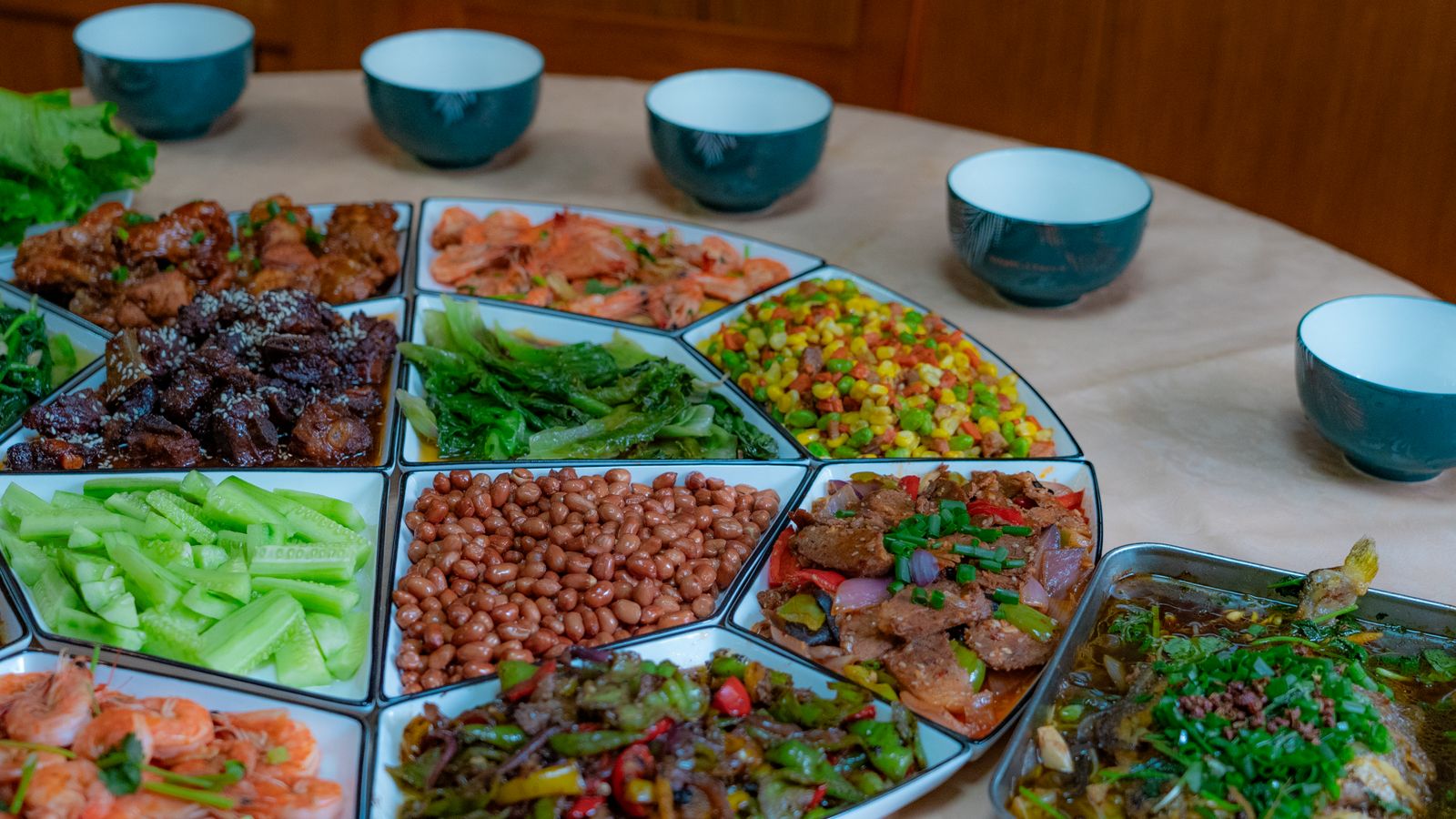 Shared dishes arranged on a round restaurant table